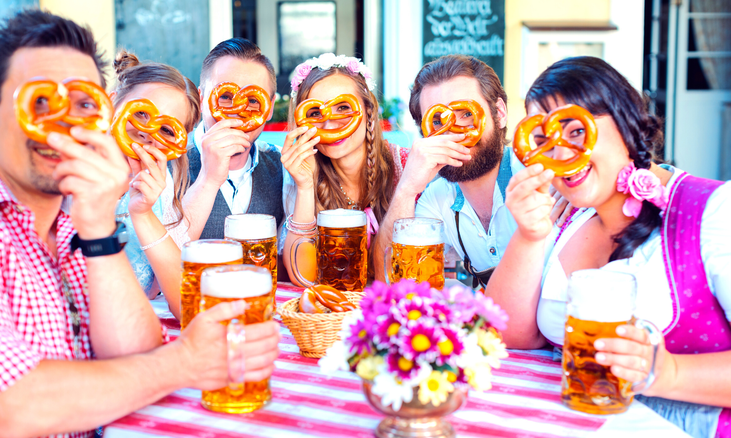 People drinking beer and eating pretzles